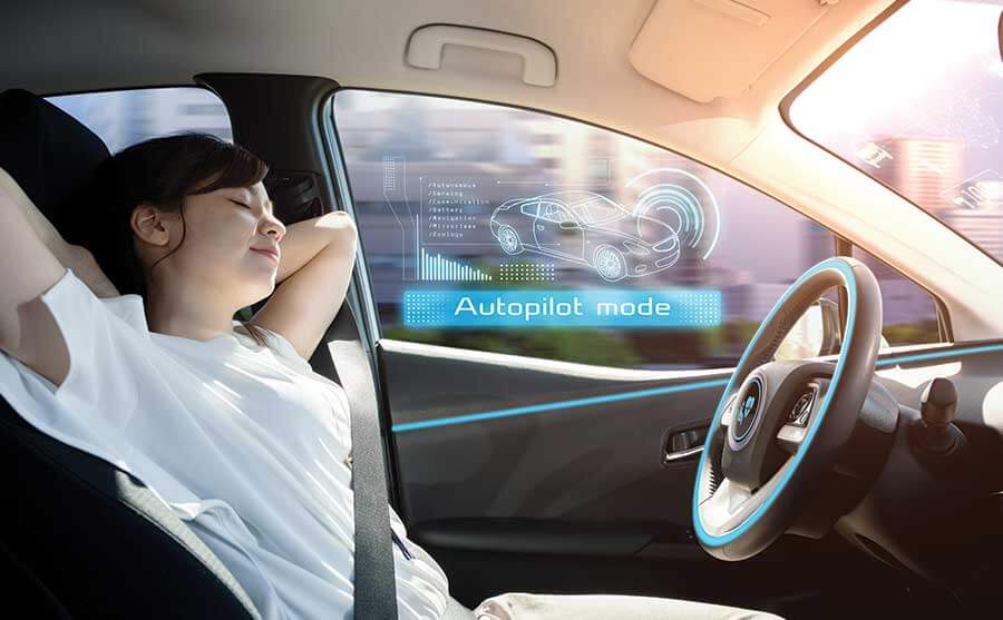 young lady naps while driving car on autopilot mode