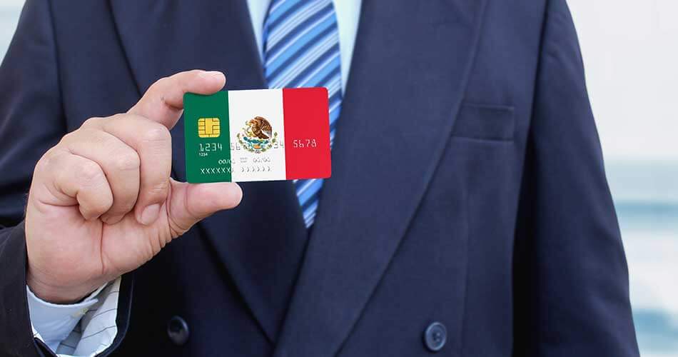 Man in suit using a debit card in Mexico