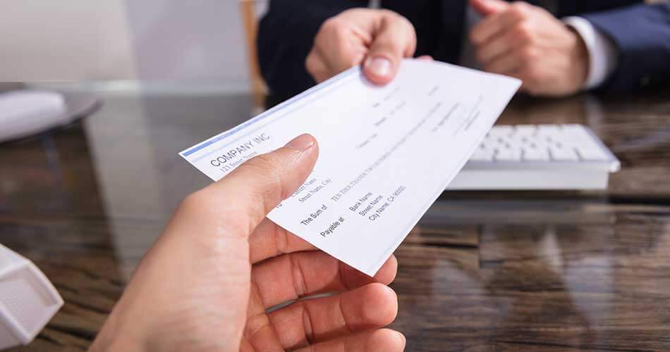 Man checks a check he received through the mail safely