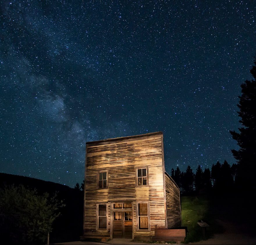Front lit old store-front under a night sky
