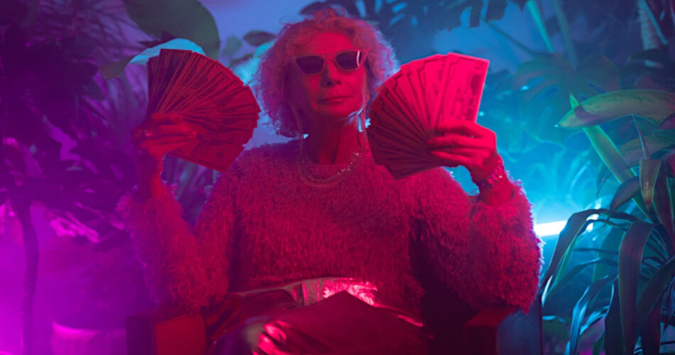 retired lady with lots of cash in pink light with blue background and house plants